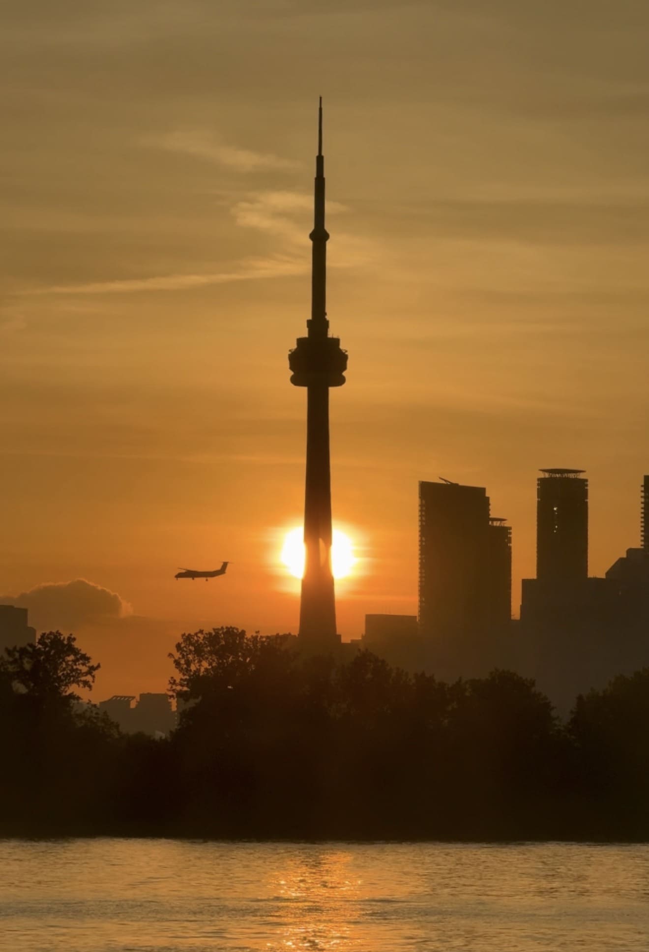 Sunset behind the CN Tower over Toronto Harbour