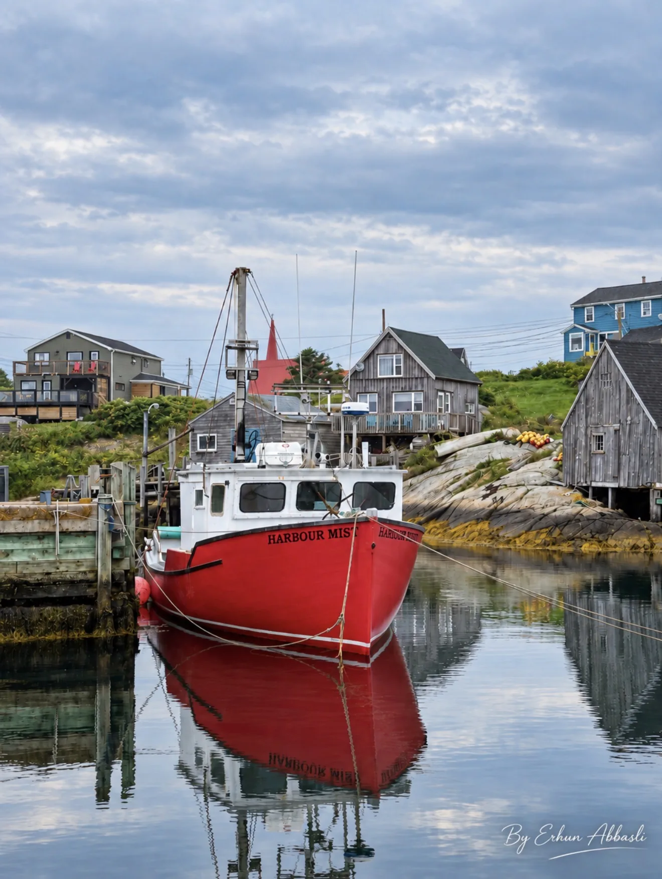 Fishing boat Harbour Mist in Peggy's Cove harbour on a Nova Scotia road trip itinerary