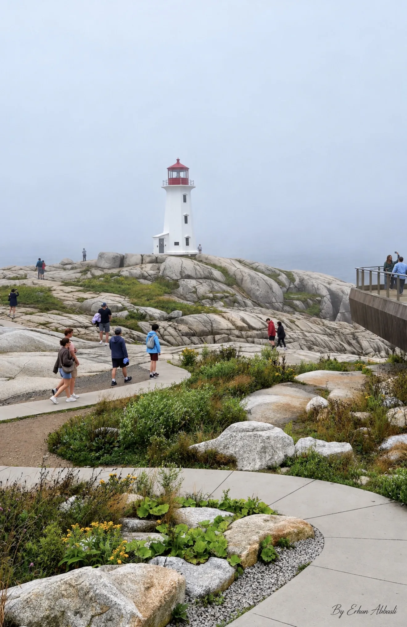 Peggy's Cove lighthouse surrounded by Atlantic fog in Nova Scotia